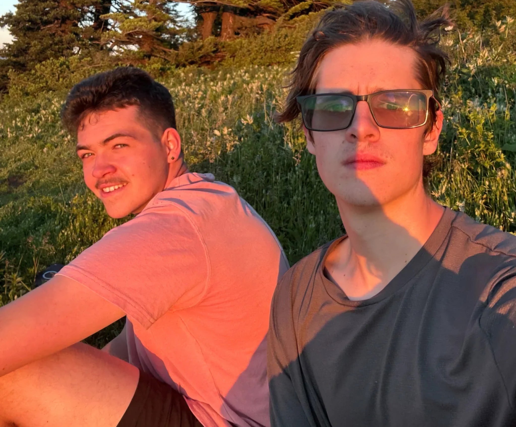 Joe and Caleb, the founders of Beacon Coffee, outdoors in warm golden light.